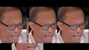 a close up of a man wearing glasses making a face