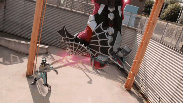 a man is standing in front of a giant robot that has the number 11 on it