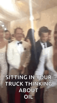 a group of people are sitting in a room and talking to each other .