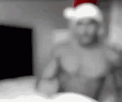 กล้าม คริสมาสต์ GIF - Model Blow A Kiss Santa Hat GIFs
