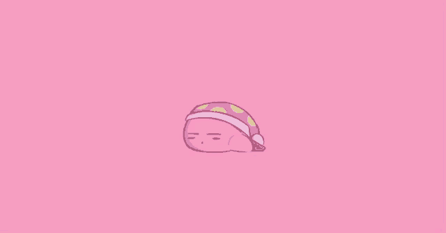 kirby is sleeping on a pink background and wearing a sleep cap .