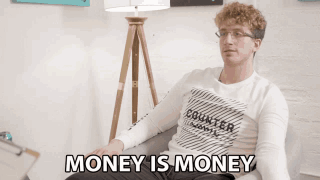 a man is sitting on a couch with the words money is money above him