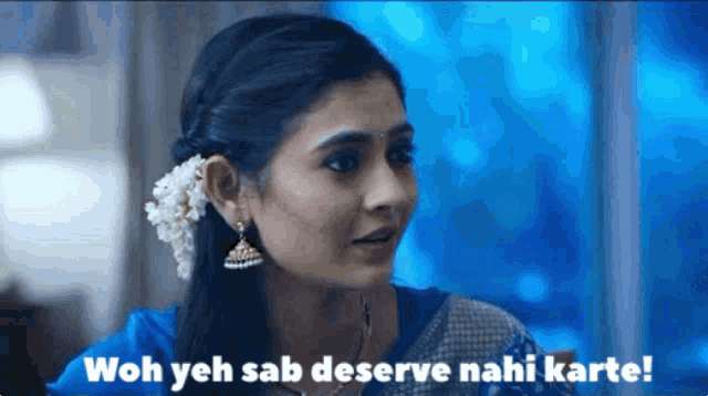 a woman with a flower in her hair says wah yeh sab deserve nahi karte