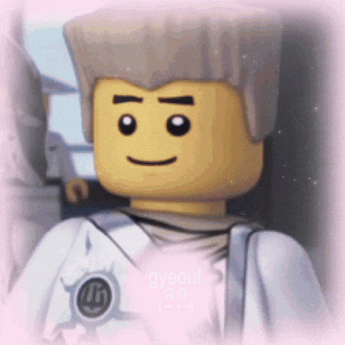 a close up of a lego character with a smile on his face .