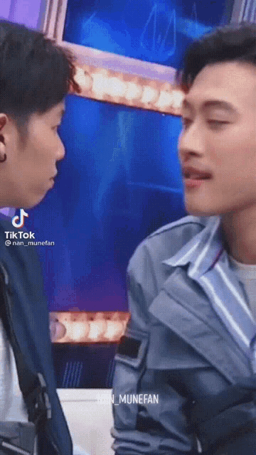 two men are standing next to each other and looking at each other with tiktok written on the bottom