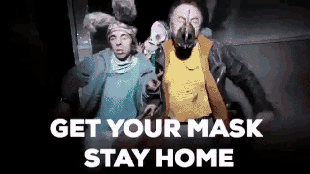 a man wearing a mask is standing next to another man with the words get your mask stay home on the bottom