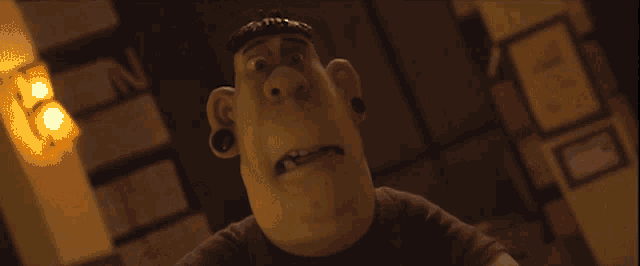 a cartoon character with piercings on his ears looks at the camera in a dark room