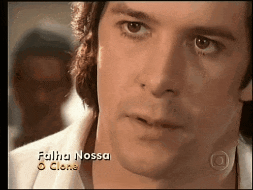 a close up of a man 's face with the words falha nossa o clone written on the bottom