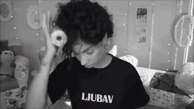a person wearing a shirt that says ljubav on it