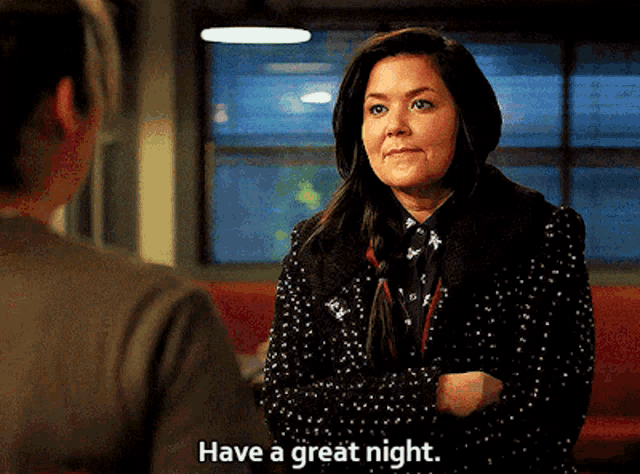 a woman in a polka dot jacket is talking to another woman and says have a great night