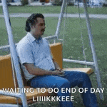 a man is sitting on a swing waiting for the end of day .