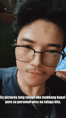 a man wearing glasses has a caption that says sa pictures lang talaga ako mukhang kuha pero sa personal miss na talaga kita