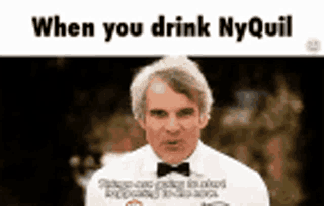 a man in a tuxedo and bow tie is talking while drinking nyquil .