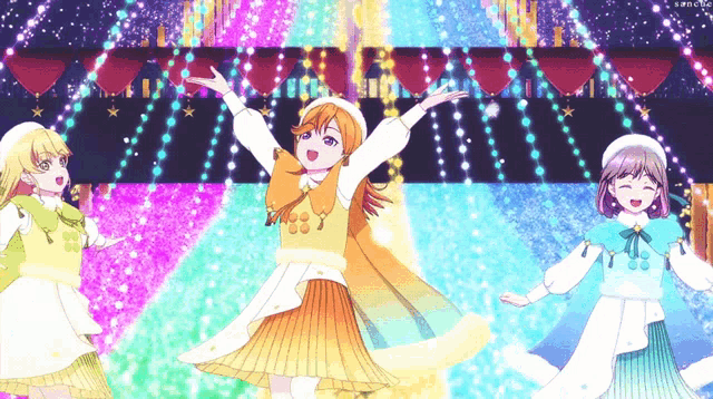 three anime girls are dancing in front of a stage