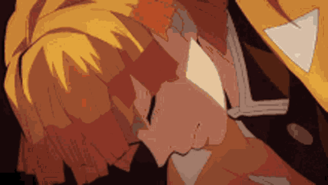 a close up of a person 's face with a yellow jacket and a white triangle on it .