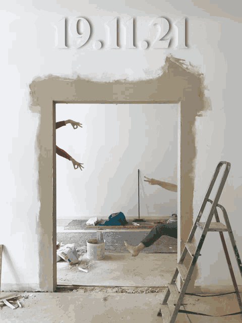 a white wall with the date 19.11.21 written on it