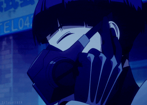 a person wearing a mask is talking on a cell phone