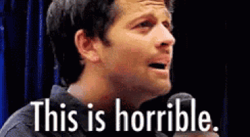 a man is holding a microphone in front of his face and saying `` this is horrible '' .