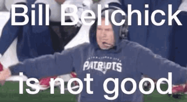 a man in a patriots sweatshirt is standing on a football field .