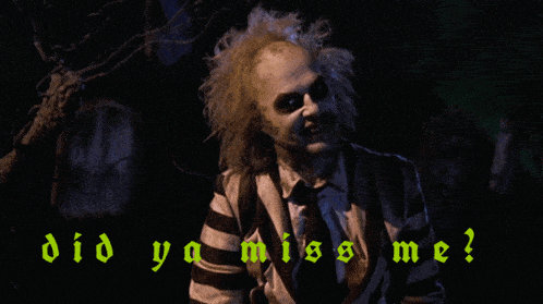 a man in a striped shirt is standing in front of a cemetery with the words did ya miss me