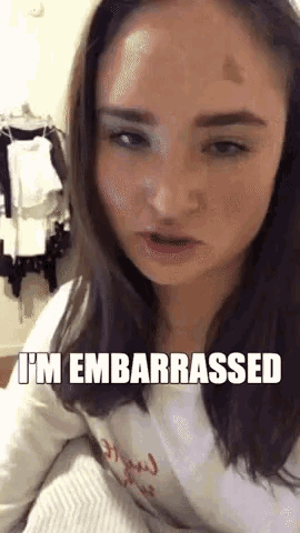 a woman is making a funny face with the words i 'm embarrassed below her