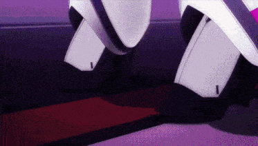 a close up of a robot 's legs standing on a purple surface .