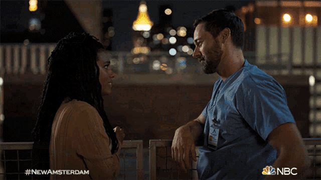 a man and a woman are looking into each other 's eyes with the hashtag #newamsterdam on the bottom