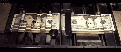 several stacks of twenty dollar bills are being printed