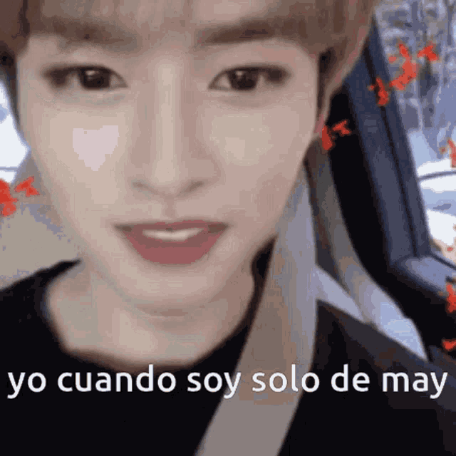 a close up of a person 's face with the words `` yo cuando soy solo de may '' written on the bottom .