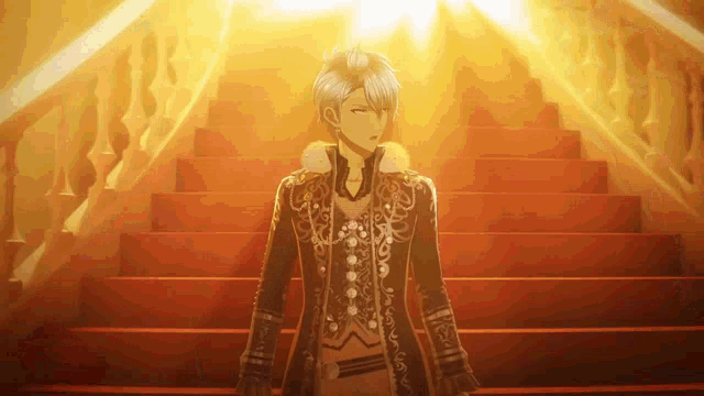 a man standing on a set of red stairs with a light shining on him