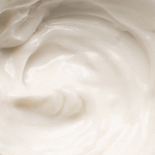 a close up of a white cream with a swirl in the middle