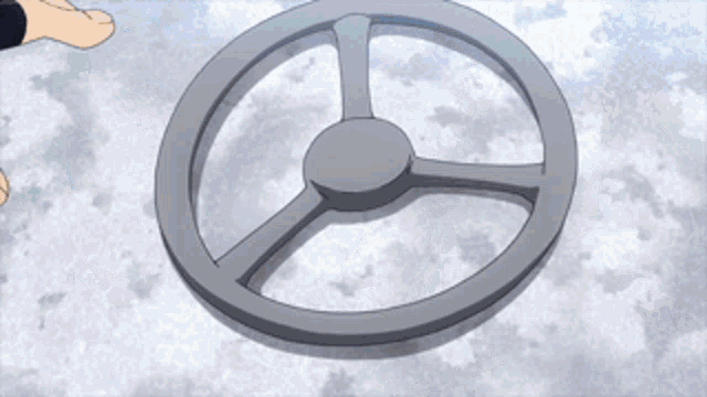 a person is holding a steering wheel with their foot