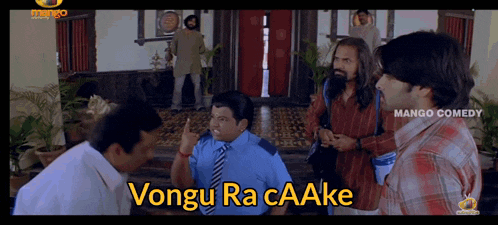 a group of men are standing in a room and one of them says " vongu ra caake " on the screen