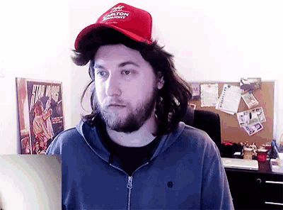 a man wearing a red hat that says jackson county on it
