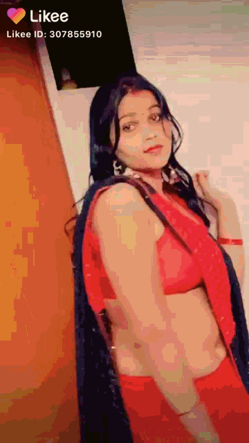 a woman in a red top and black saree has a likee id of 3078559110