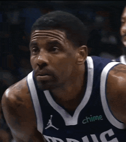 a basketball player wearing a jersey that says chime