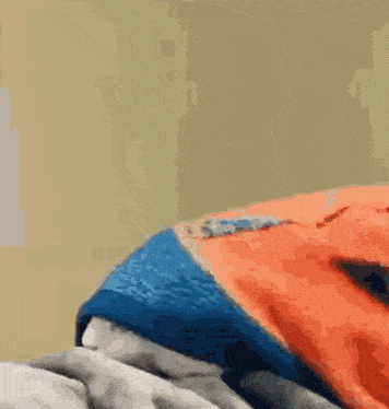 a close up of a person laying on a bed