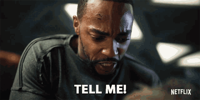 a man with a beard says tell me on a netflix ad