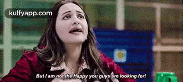 a woman is sitting at a table and says but i am not the happy you guys are looking for