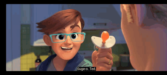 a boy with glasses is holding a pacifier and says " sage-o-ted " at the bottom