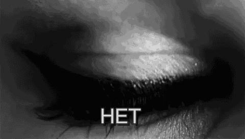 a black and white photo of a woman 's eye with the words `` het '' written on it .