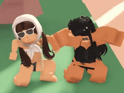 two roblox girls are dancing together on a green surface .