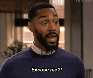 a man with a beard is making a funny face and saying excuse me ?