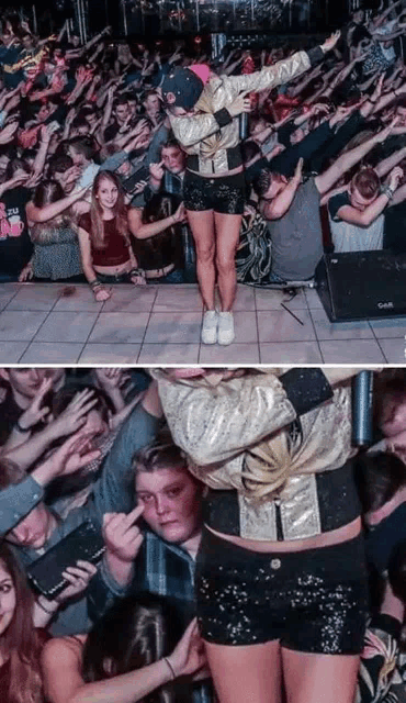 a woman in a gold jacket is standing on stage in front of a crowd