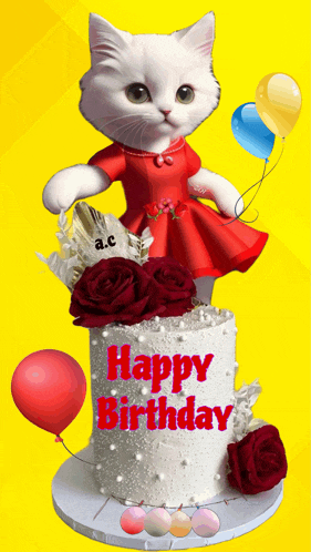 a white cat in a red dress stands on top of a birthday cake