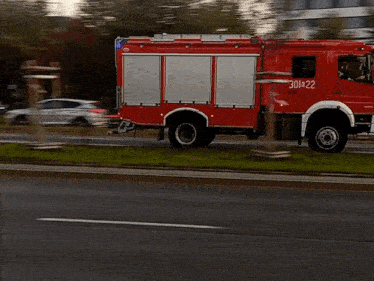 a red fire truck with the number 301422 on it