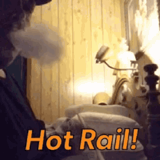 a man smoking a hookah with the words hot rail written on the bottom