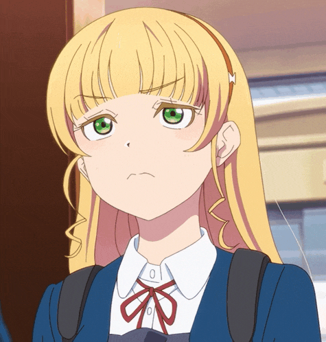 a girl with blonde hair and green eyes is wearing a blue uniform
