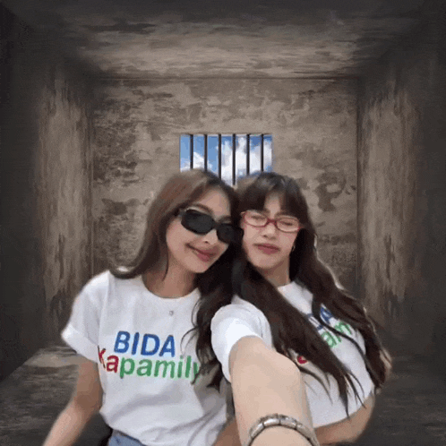 two girls wearing shirts that say bida kapamily