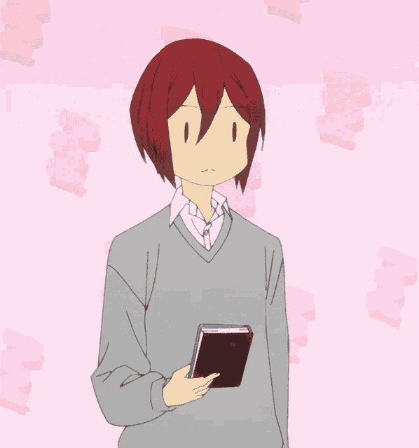 a man with red hair is holding a book in his hand